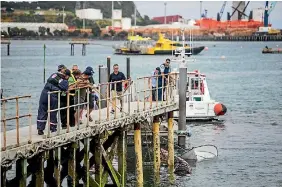  ?? PHOTO: SIMON O’CONNOR/STUFF ?? Teiron Jones’ boat is pulled from the water at Port Taranaki on Friday after it was towed from Waitara.