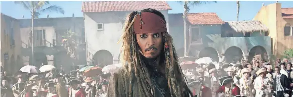  ?? PIRATES AND ALICE PHOTOS BY DISNEY ?? Johnny Depp returns to the dreadlocks and eyeliner of drunkard Captain Jack Sparrow in Pirates of the Caribbean: Dead Men Tell No Tales.