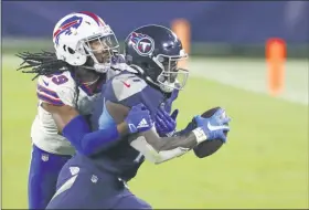  ?? WADE PAYNE - THE ASSOCIATED PRESS ?? Tennessee Titanswide receiver A.J. Brown (11) is stopped by Buffalo Bills cornerback Josh Norman (29) in the second half of an NFL football game Tuesday, Oct. 13, 2020, in Nashville, Tenn.