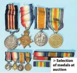  ??  ?? > Selection of medals at auction