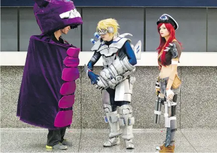  ?? P H I L C A R P E N T E R / MO N T R E A L G A Z E T T E F I L E S ?? Friends wearing League of Legends game character costumes — Marc- Antoine Carreau, left, Alexandre G. Goyette and Audrey Roy — leave the Palais des Congrès last year after attending Comiccon. This year’s convention at the Palais will be held July 3- 5.