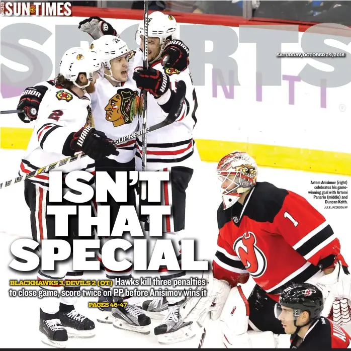  ?? JULIE JACOBSON/ AP ?? Artem Anisimov ( right) celebrates his gamewinnin­g goal with Artemi Panarin ( middle) and Duncan Keith.