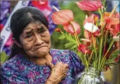  ?? FEDERICO RIOS ESCOBAR / THE NEW YORK TIMES ?? Isabel Jimenez, mother of Olmes Niscue, who was killed by unknown shooters, cries Aug. 23 next to his grave in Pradera, Colombia.