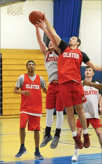  ?? TANIA BARRICKLO — DAILY FREEMAN ?? Saugerties High graduate Shawn Jansen, left, and Kingston product Alex Karamanos battle for rebound during recent SUNY Ulster men’s basketball practice at Senate Gymnasium for the NJCAA national tournament.