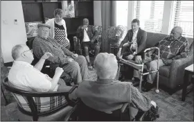  ?? Arkansas Democrat-Gazette/STEPHEN B. THORNTON ?? Administra­tor Lindsey Cleburne (second from right) visits with residents in a common lounge area Wednesday in a cottage at the new Arkansas State Veterans Home on Wednesday in North Little Rock.