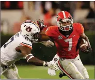  ?? AP/JOHN BAZEMORE ?? Georgia running back D’Andre Swift (7) rushed for 186 yards and had a 77-yard touchdown run in the Bulldogs’ 27-10 victory over Auburn on Saturday night in Athens, Ga.