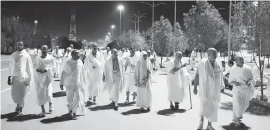  ??  ?? Muslim pilgrims walk towards Mount Arafat yesterday to prepare for the climax of the annual hajj pilgrimage, near the Saudi holy city of Mecca