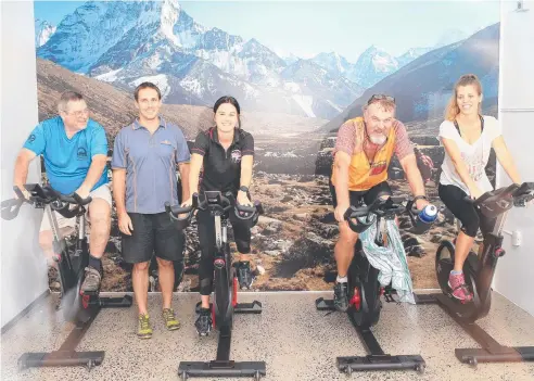  ?? Picture: JUSTIN BRIERTY ?? Scott Payne (left) at his new altitude training facility, the only one north of Brisbane. Testing out the new room are Peter Dobbin, Mikaela Dorney, John Petersen and Nichola Easton.