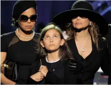  ??  ?? Clockwise from above: Eleven-year-old Paris at her father’s public memorial service in 2009, flanked by her aunts Janet, left, and LaToya; Michael Jackson and Deborah Rowe, who is pregnant with Paris, minutes after they got married in November 1996;...