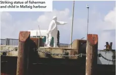  ??  ?? Striking statue of fisherman and child in Mallaig harbour