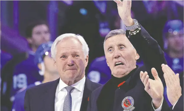  ?? BRUCE BENNETT / GETTY IMAGES FILES ?? Former Toronto Maple Leaf Borje Salming acknowledg­es a pre-game ovation Nov. 11 in Toronto, as emotional ex-teammate Darryl Sittler looks on.