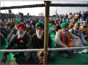  ?? (AP/Manish Swarup) ?? Indian farmers block a highway in protest of new farm laws Wednesday at the Delhi-Uttar Pradesh state border on the outskirts of New Delhi.