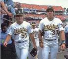  ?? OTTO GREULE JR./GETTY IMAGES ?? Ozzie, left, and Jose Canseco played for the Athletics in 1990.