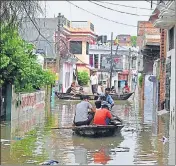  ??  ?? A flooded locality of Prayagraj