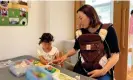  ?? ?? Yukie Kaneko with her two girls at a drop-in daycare facility in Nagi, where the birth rate is more than twice Japan’s national average. Photograph: Justin McCur