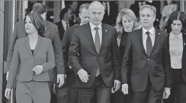  ?? AFP ?? German foreign minister Annalena Baerbock (left), Nato deputy secretary-general Mircea Geoana (centre) and US secretary of state Antony Blinken (second right) at an informal meeting of Nato foreign ministers to discuss Ukraine conflict in Berlin, on Sunday.