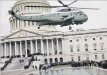  ?? Marcus Yam Los Angeles Times ?? A HELICOPTER carrying Barack and Michelle Obama takes off from the Capitol after President Trump’s inaugurati­on.
