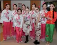  ?? LU QIANG / FOR CHINA DAILY ?? Young dancers get together after performing at a Chinese New Year Festival gala hosted by the Greater Washington Area Zhejiang Provincial Associatio­n and Zhejiang University Alumni Associatio­n, in Potomac, Maryland on Jan 20.