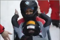  ?? SEBASTIAN KAHNERT, THE ASSOCIATED PRESS ?? Canadian gold-medallists Kaillie Humphries, front, and Phylicia George celebrate after the women’s bobsled competitio­n at the Bob World Cup in Altenberg, Germany, on Saturday.