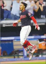  ?? Associated Press photo ?? Cleveland Indians' Francisco Lindor celebrates as he runs the bases after hitting a solo home run off Toronto Blue Jays relief pitcher Danny Barnes in the 10th inning of a baseball game, Saturday in Cleveland.