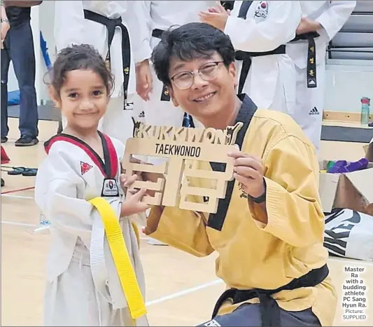  ?? Picture: SUPPLIED ?? Master Ra with a budding athlete PC Sang Hyun Ra.