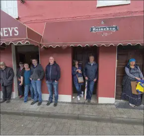  ??  ?? Taking shelter from the rain at the Cahirmee Horse Fair in Buttevant.