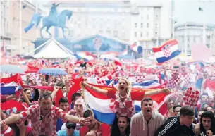  ?? PHOTO: REUTERS ?? Croatia fans erupt at the fan zone in Zagreb.