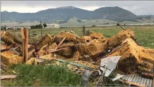  ?? Courtesy Photo / Don Embler, Pepper Sauce Camp ?? A pile of hay and debris are all that remain of a hay barn at the Pepper Sauce Camp following a rare landspout tornado that formed in Eagle Nest Thursday (Aug. 9).