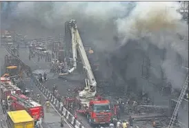  ??  ?? A massive fire broke out at a handloom shop on Veer Savarkar Marg in south Delhi’s Lajpat Nagar market on Saturday morning. It spread to at least four more shops and damaged goods worth ₹7-8 crore, said fire officials and traders. No injuries were reported.