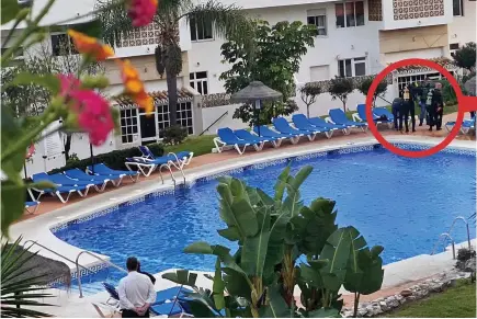  ??  ?? Investigat­ion: Police divers were seen at the resort’s pool after the triple tragedy on Christmas Eve