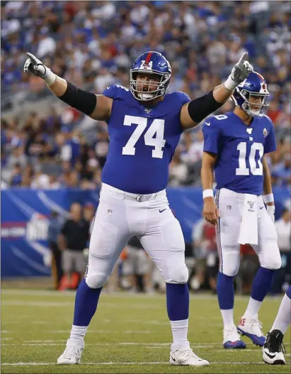  ?? ADAM HUNGER — THE ASSOCIATED PRESS ?? Giants right tackle Mike Remmers (74) motions at the line of scrimmage against the Bears during the first quarter of last Friday’s preseason game at MetLife Stadium.