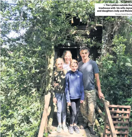  ?? Picture: Daniel Mumby ?? Tim Lyddon outside the treehouse with his wife Jayne and daughters Jody and Maisie