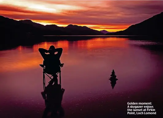  ??  ?? Golden moment: A skygazer enjoys the sunset at Firkin Point, Loch Lomond