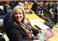  ?? ?? Ms Kathi Shea, a delegate from the United States holds First Lady Dr Auxillia Mnangagwa’s Angel of Hope Foundation magazine during the 28th OAFLAD general assembly in Addis Ababa, Ethiopia, yesterday