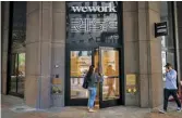  ??  ?? From top Adam Neumann with Ashton Kutcher at a Wework ‘festival’ in 2019; a Wework space; offices in New York’s Financial District