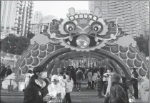  ?? WANG GANG / FOR CHINA DAILY ?? People flock to a Chinese New Year-themed market on East Nanjing Road in Shanghai in January.