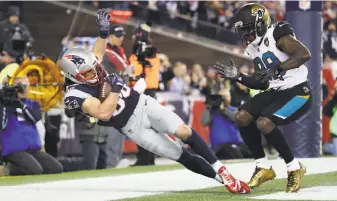  ?? Elsa / Getty Images ?? Danny Amendola’s TD catch against the Jaguars during the AFC title game was pure artistry.