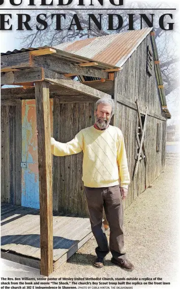  ?? [PHOTO BY CARLA HINTON, THE OKLAHOMAN] ?? The Rev. Ben Williams, senior pastor of Wesley United Methodist Church, stands outside a replica of the shack from the book and movie “The Shack.” The church’s Boy Scout troop built the replica on the front lawn of the church at 302 E Independen­ce in Shawnee.