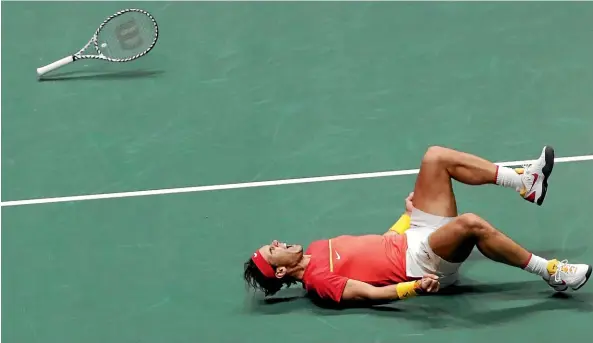  ?? AP ?? Spain’s Rafael Nadal celebrates after he and Davis Cup team-mate Feliciano Lopez beat Great Britain’s Jamie Murray and Neal Skupski in Madrid.