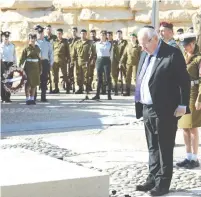  ?? (Mark Neiman/GPO) ?? PRESIDENT REUVEN RIVLIN lays a wreath at the memorial ceremony for Israel’s founding prime minister David BenGurion yesterday at Sde Boker.