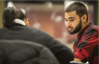  ?? CHRIS YOUNG/THE CANADIAN PRESS ?? A tutor works with a student at an Oxford Learning program. Enrolment in private math tutoring is on the rise.