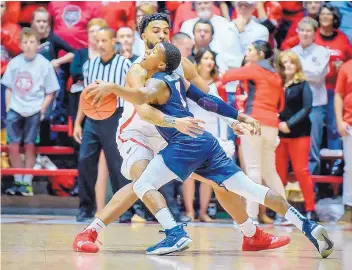  ?? ROBERTO E. ROSALES/JOURNAL ?? UNM’s Karim Ezzeddine, left, fouls UTEP’s Evan Gilyard, during Saturday’s game. Gilyard scored 22 points and shot 5 for 9 from 3-point range. He was another guard under six feet who gave UNM fits.