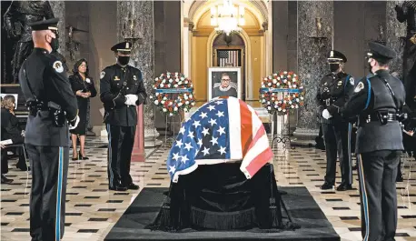  ?? ERIN SCHAFF/THE NEW YORK TIMES ?? Justice Ruth Bader Ginsburg lies in state in Statuary Hall on Friday. She is the first woman to receive the honor.