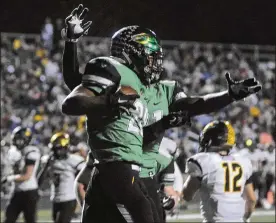  ?? MARC PENDLETON / STAFF ?? Northmont’s Devin Kenerly celebrates his 19-yard TD run. Northmont defeated previously unbeaten Centervill­e 21-14 in a GWOC showdown Friday.