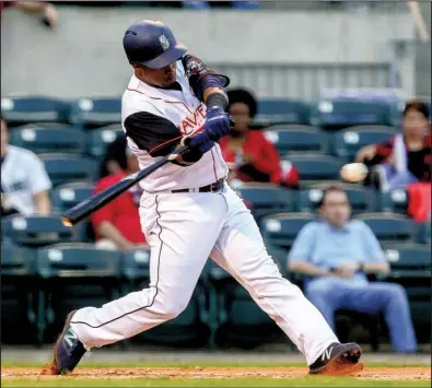  ?? Arkansas Democrat-Gazette/MITCHELL PE MASILUN ?? Jean Segura flies out for the Arkansas Travelers during the first inning of Friday night’s game at Dickey-Stephens Park in North Little Rock. Segura, the shortstop for the Seattle Mariners, is with the Travelers for a three-day rehab assignment.