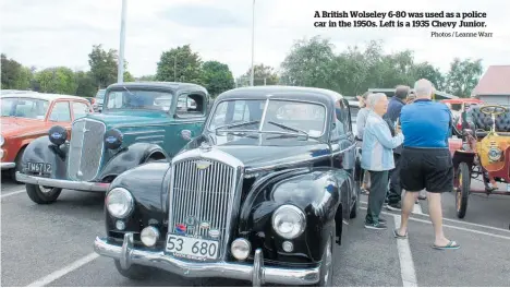  ?? Photos / Leanne Warr ?? A British Wolseley 6-80 was used as a police car in the 1950s. Left is a 1935 Chevy Junior.