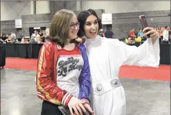  ?? The Sentinel-Record/Mara Kuhn ?? OUR ONLY HOPE: Laurel Wilson, 14, of Little Rock, left, and Destiny Clowers, of Hot Springs, take a selfie during Spa-Con Saturday at the Hot Springs Convention Center.