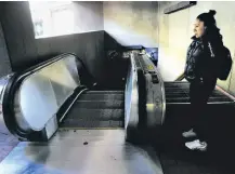  ??  ?? Above: A woman tries to enter the Montgomery Street BART Station before realizing it was closed by a blackout.