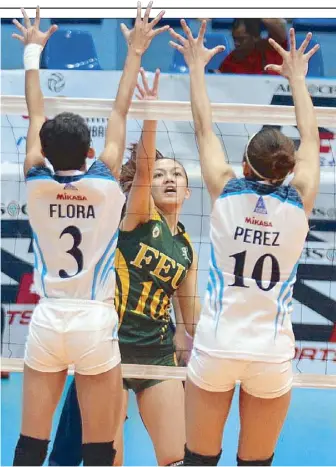  ??  ?? FEU’s Toni Rose Basas (10) fires a looper of a spike against Adamson’s Lea-Ann Perez and Bernadette Flora during their rubber match for the second finals berth in the PVL Collegiate Conference at the San Juan Arena. JUN MENDOZA