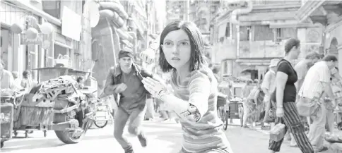  ??  ?? Salazar, centre, with Keean Johnson in sci-fi action adventure ‘Alita: Battle Angel’. — Courtesy of Twentieth Century Fox